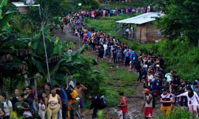 - migrantes hacen fila el darien ap